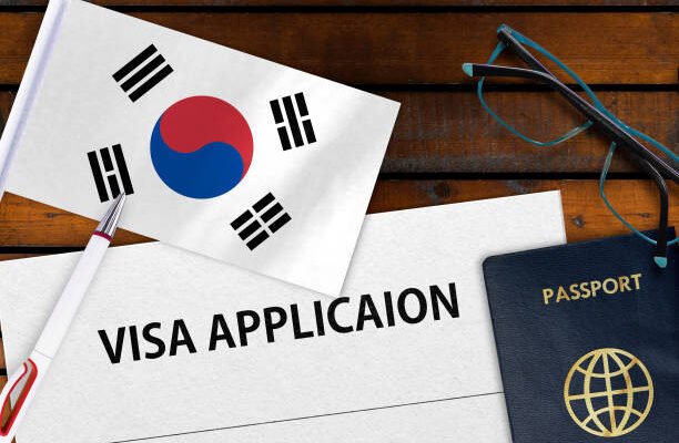 Flag of South Korea, visa application form and passport on table