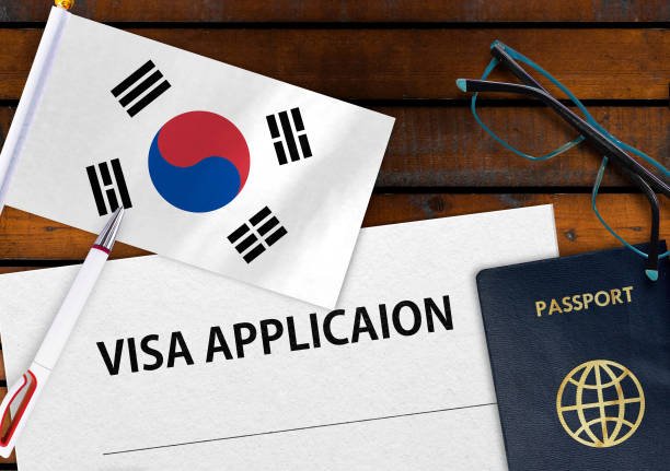 Flag of South Korea, visa application form and passport on table